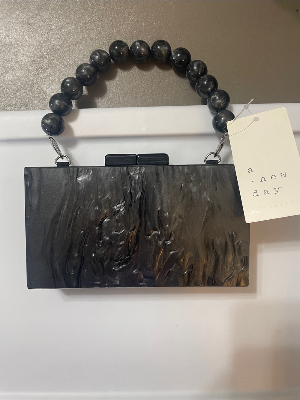a new day Black Marbled Acrylic Clutch with Beaded Handle NWT very beautiful